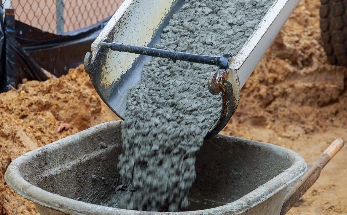 Wheelbarrow with shovel full of cement